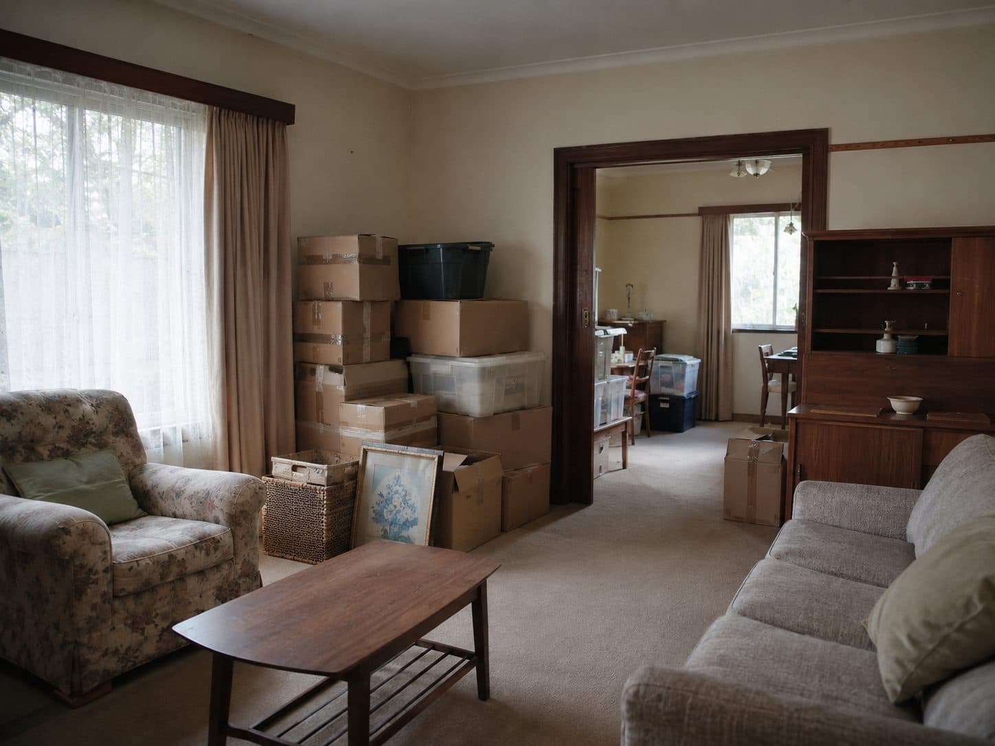 Older Gold Coast home lounge room with boxed belongings during a full estate clean-out