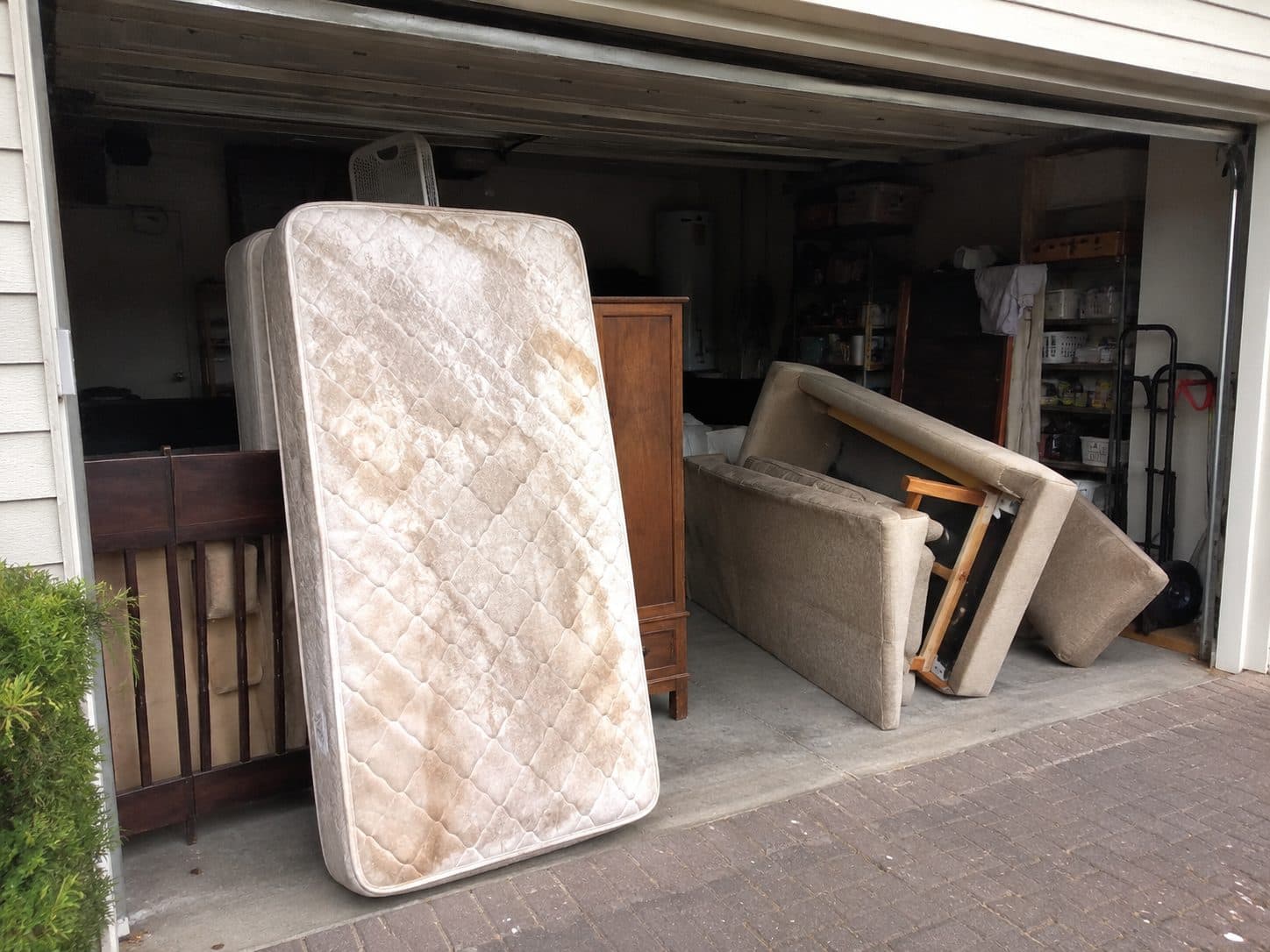 Old lounge, table and furniture stacked for removal on the Gold Coast