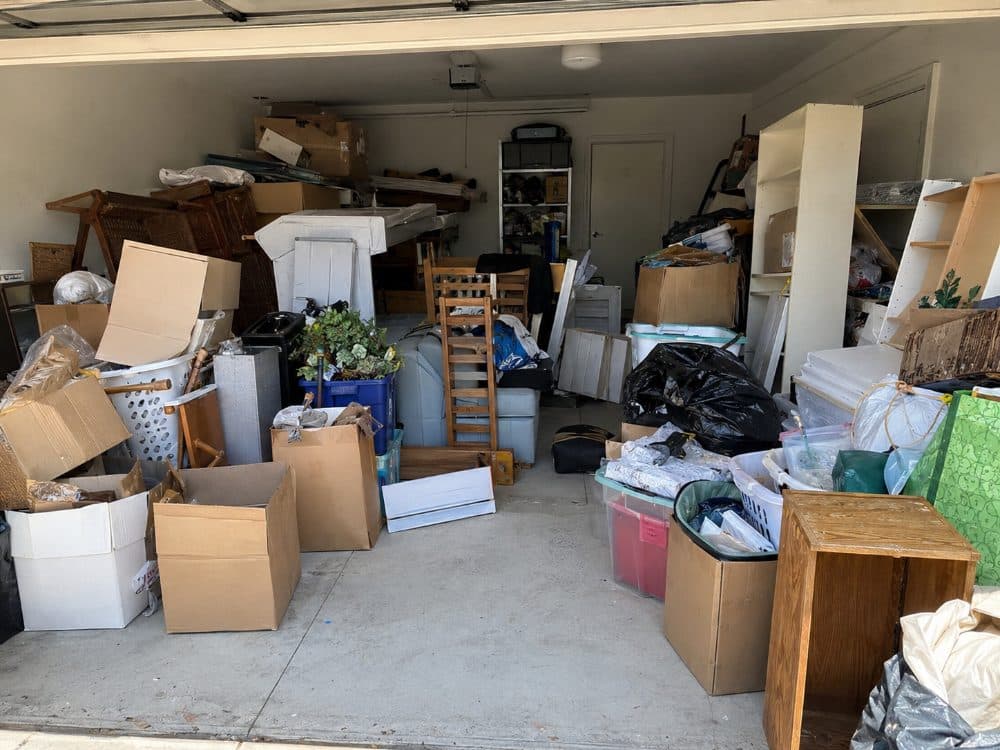 Packed double garage before a clean-out on the Gold Coast
